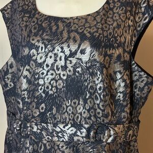 Elegant sleeveless black dress with gold peacock pattern print